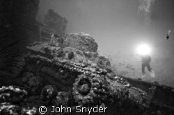 Diver shooting Tank in Truk Lagoon by John Snyder 